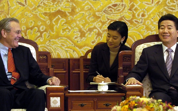 Secretary Rumsfeld shares a lighter moment with South Korean President Roh Moo-hyun at the Blue House in Seoul.