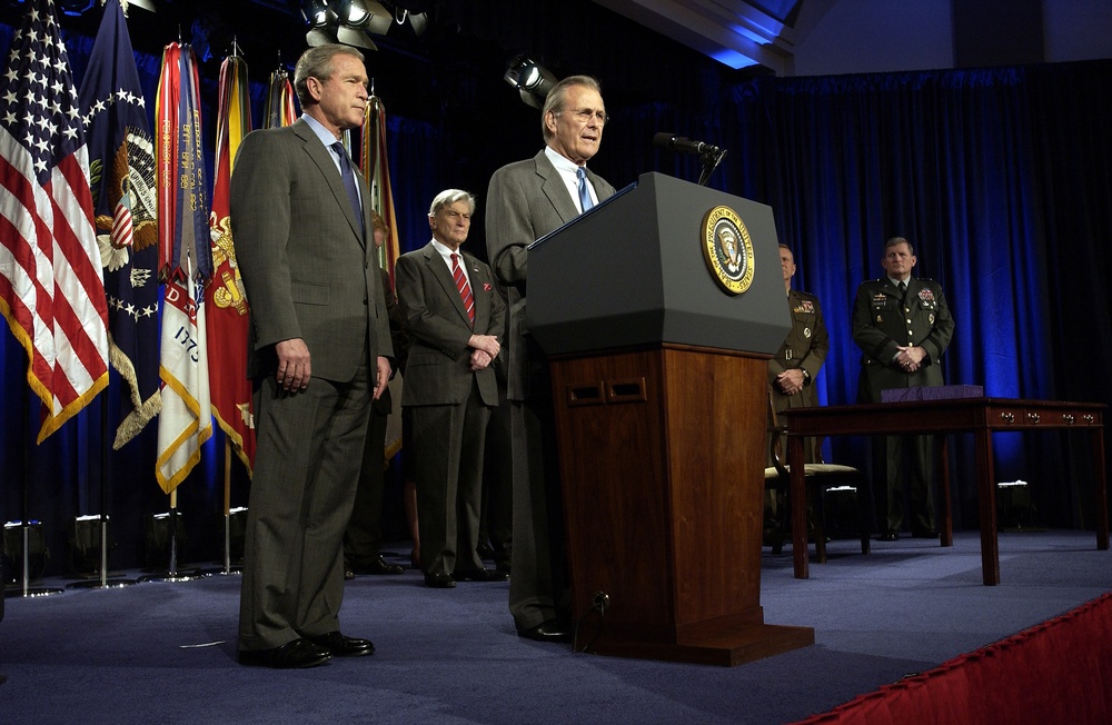 Secretary Rumsfeld introduces President Bush to the audience in the Pentagon.