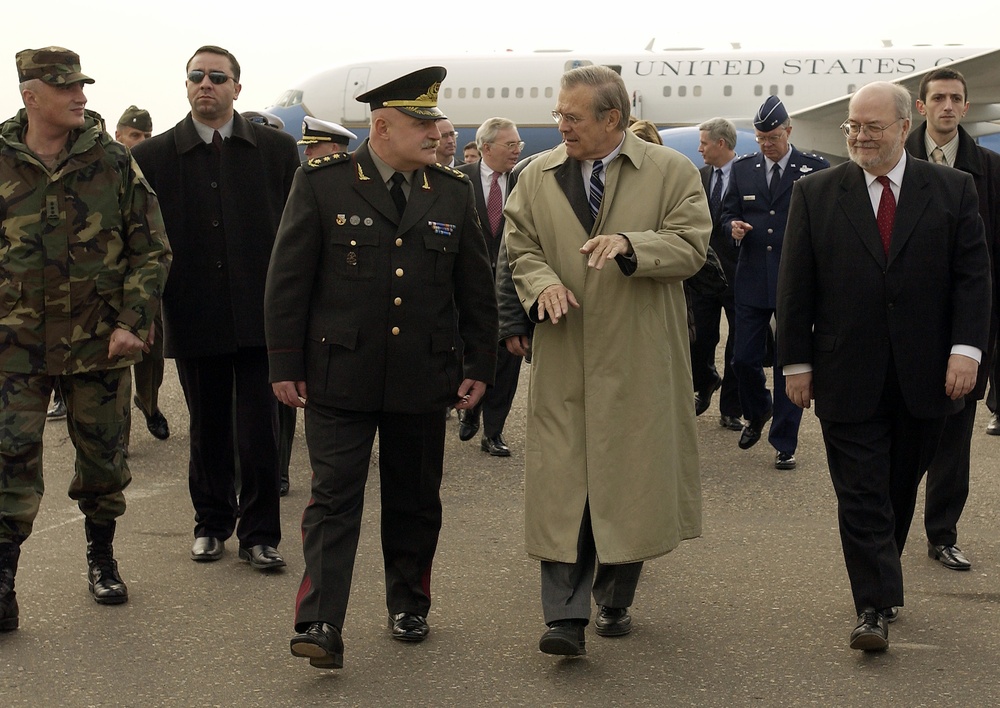 Secretary Rumsfeld talks with Georgian Minister of Defense Gen. David Tevzadze after arriving at Tbilisi, Georgia.