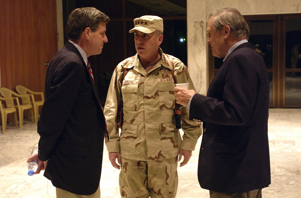 Gen. Abizaid talks with Secretary Rumsfeld and Ambassador Bremer before Rumsfeld's departure from Baghdad, Iraq.