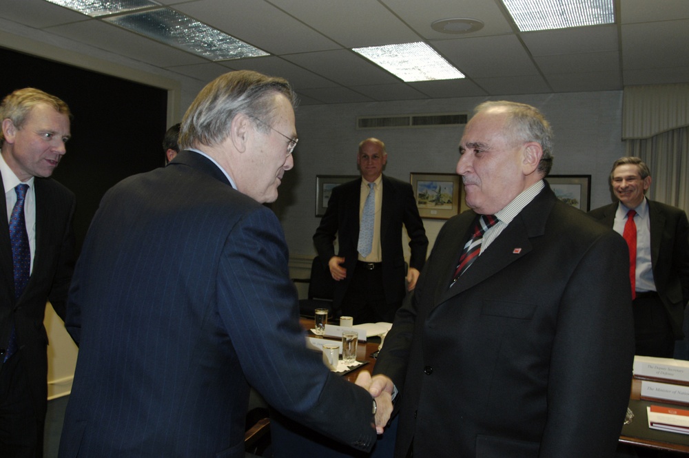Secretary of Defense Donald H. Rumsfeld greets Turkish Minister of National Defense Vecdi Gonul.