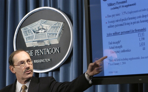 Under Secretary of Defense, Comptroller, Zakheim refers to a chart as he presents the Department of Defense 2005 budget.