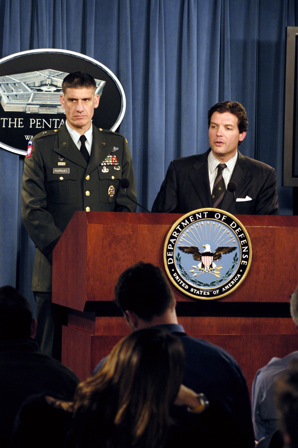 Principal Deputy Assistant Secretary of Defense for Public Affairs Lawrence Di Rita responds to a reporter's question during a press briefing.