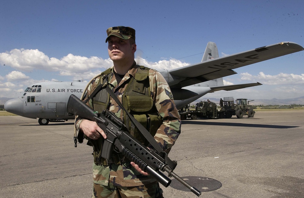 Senior Airman Rick Montonario secures the ramp at the Port-au-Prince airport in Haiti.