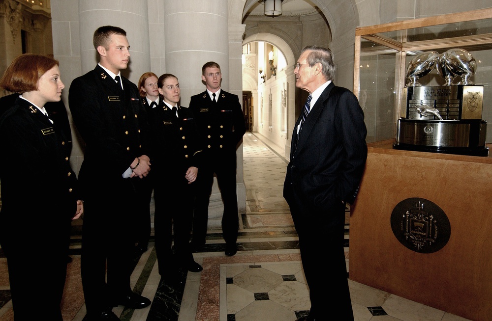 Secretary of Defense Rumsfeld talks to a group of midshipmen at the Naval Academy.