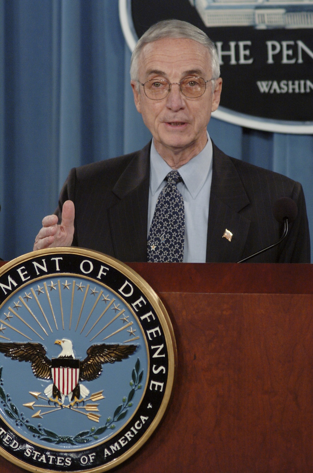 Secretary of the Navy Gordon R. England briefs reporters in the Pentagon.