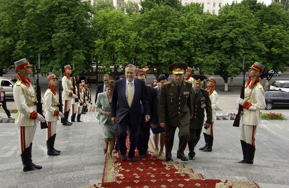 Secretary Rumsfeld and Moldovan Minister of Defense Brig. Gen. Victor Gaiciuc walk into the capitol.