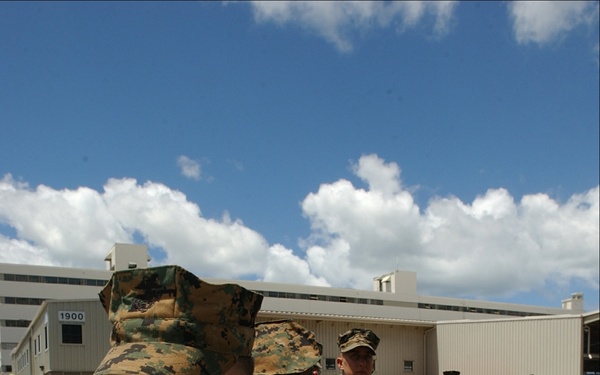 Marines line up to embark on the USS Tarawa (LHA 1).