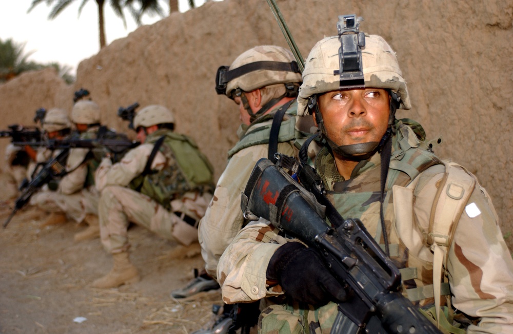 Sgt. Stephen Edwards secures the end of his Team's assault formation.