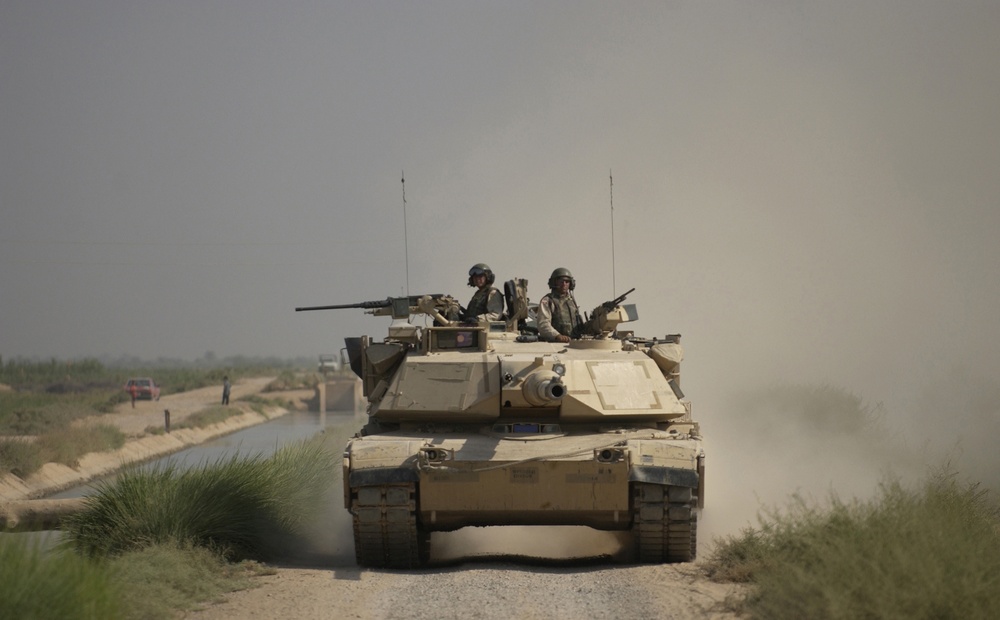 A U.S. Army M1A1 Abrams Main Battle Tank conducts an area reconnaissance.