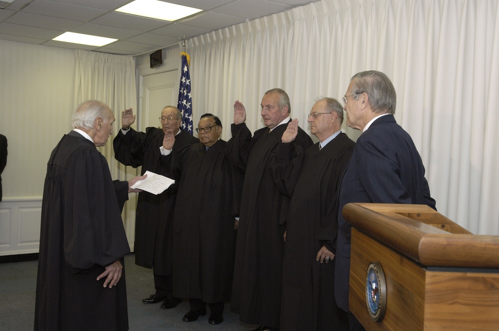 Secretary Rumsfeld watches as the first Military Commissions Review Panel members are sworn in.