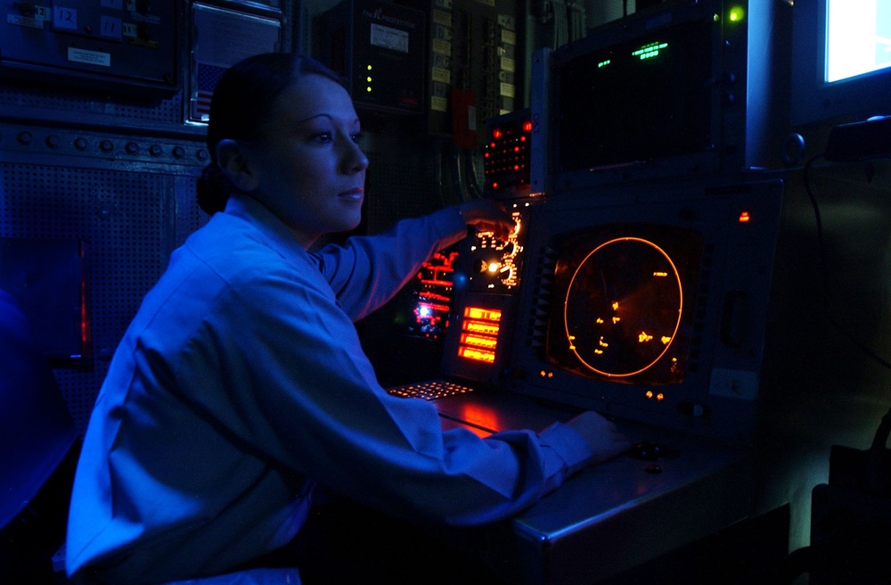Petty Officer 3rd class Amy Ramirez monitors a tactical situation display screen.