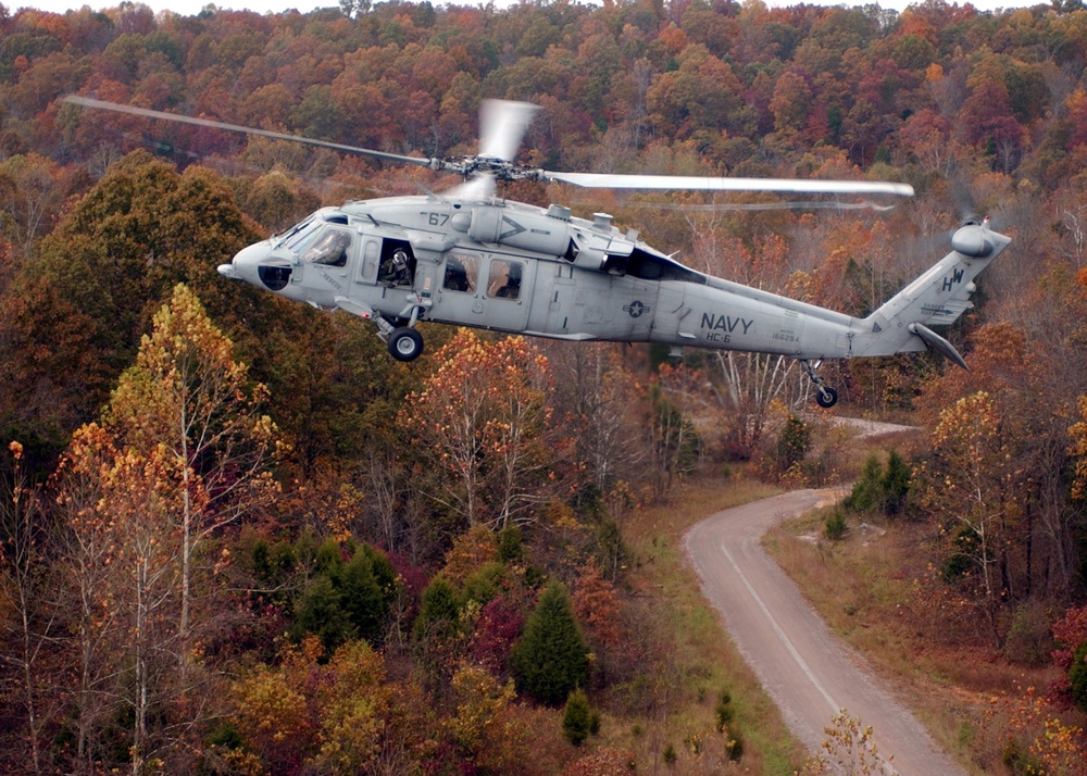 An MH-60S Knighthawk helicopter flies over Fort Knox, Ky.