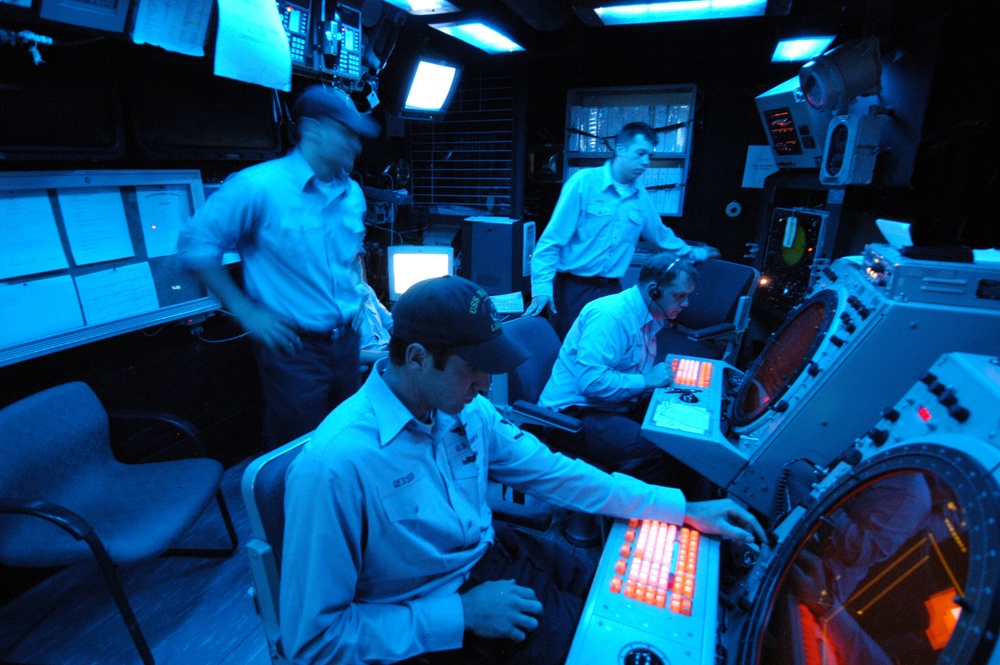 Petty Officer 3rd class Jeff Gessler watches a radar screen.