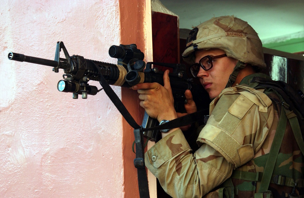 A U.S. Army soldier watches for insurgents in Fallujah, Iraq.