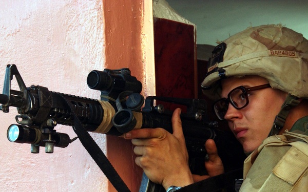 A U.S. Army soldier watches for insurgents in Fallujah, Iraq.