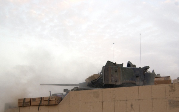 A U.S. Army M3A3 Bradley Cavalry Fighting Vehicle test fires its 25-millimeter chain gun.