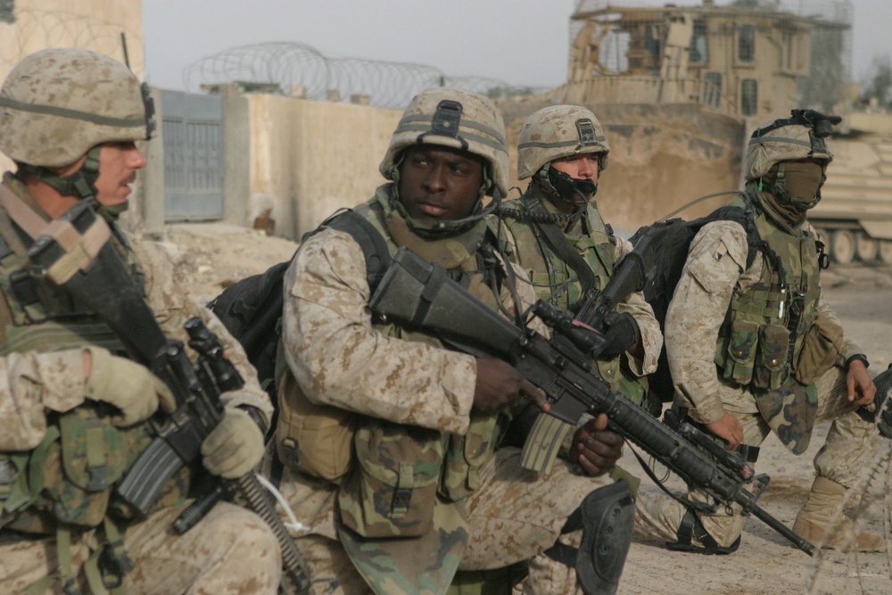 U.S. Marines prepare to step off on a patrol through the city of Fallujah, Iraq.