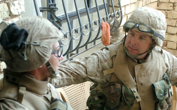 Navy Chaplain Lt. Kenny Lee talks with Lance Cpl. Kris Latorre.