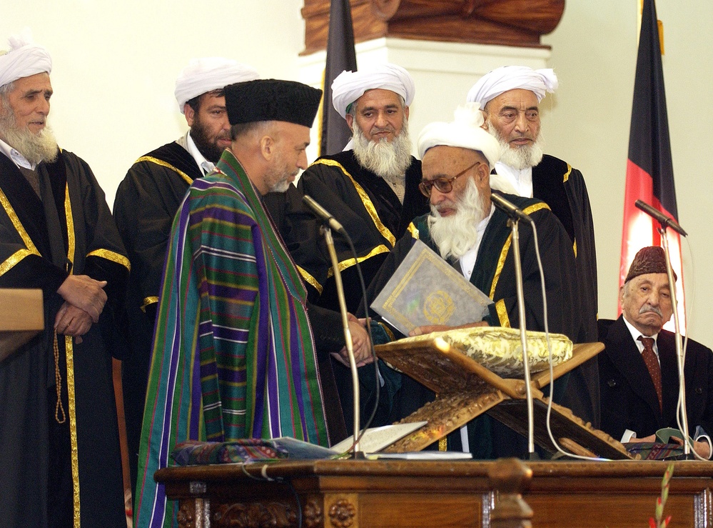 Afghanistan President Karzai is congratulated by Chief Justice Faisal Ahmad Shinwari.