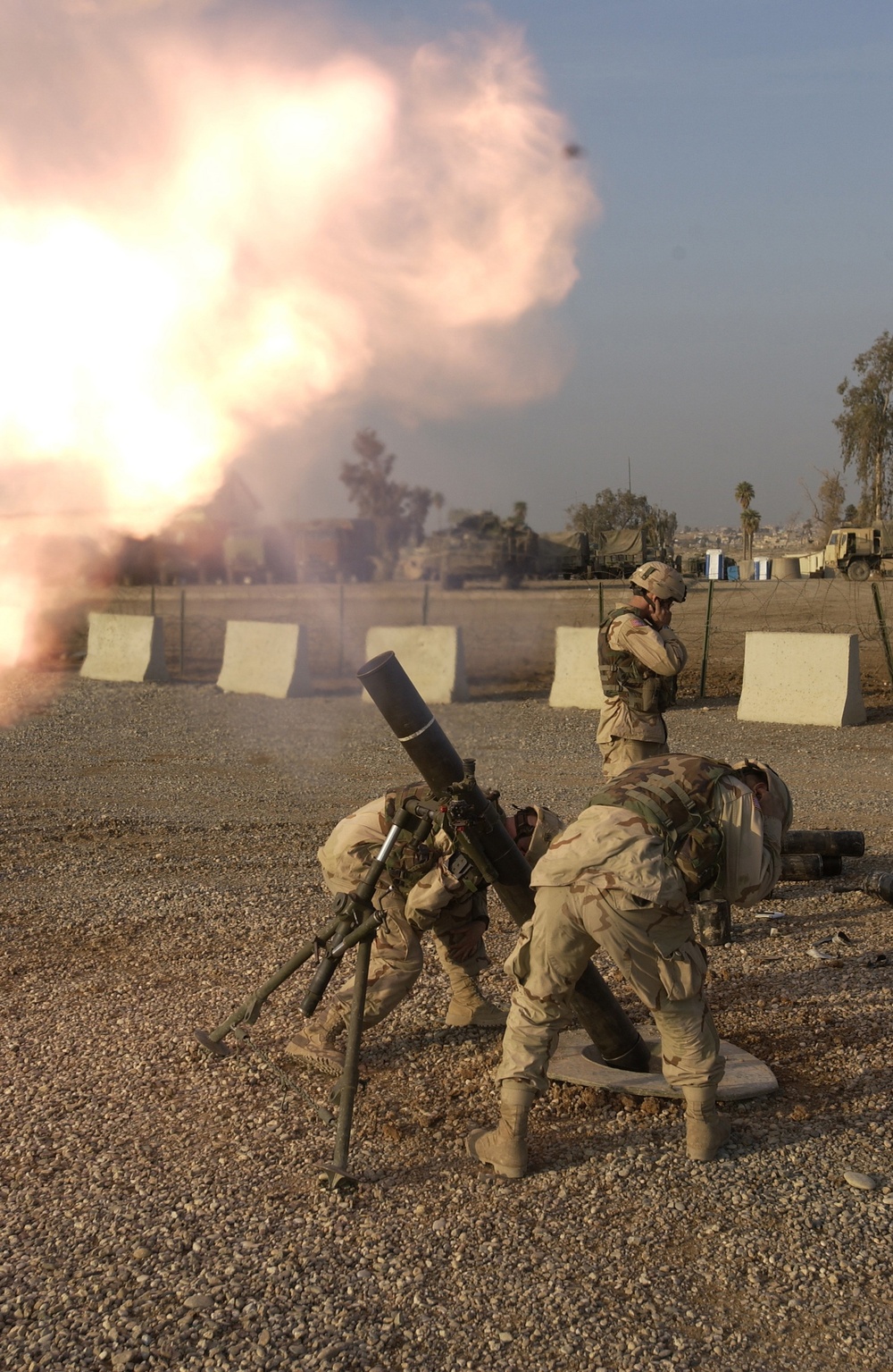 U.S. Army soldiers fire 120mm mortars.