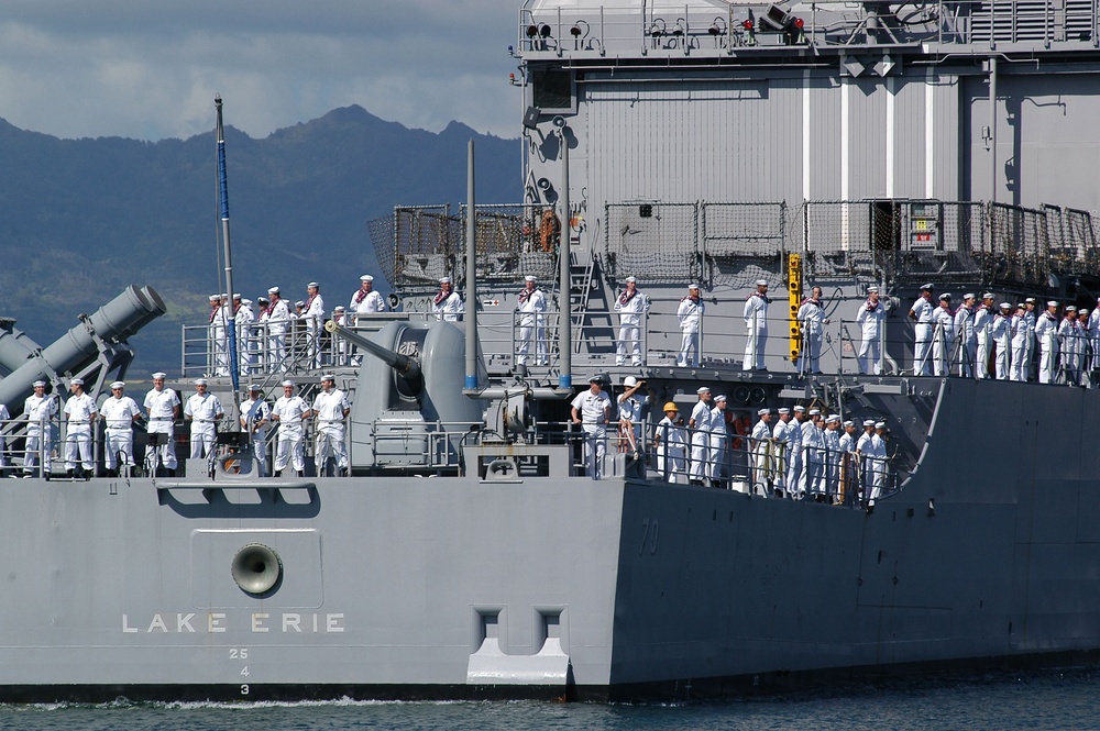 The crew of the guided missile cruiser USS Lake Erie (CG 70) mans the rail.