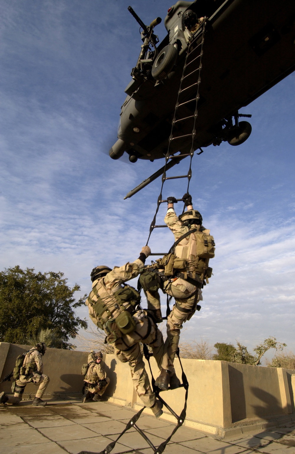 U.S. Air Force Para-rescuemen are extracted by an HH-60G Pave Hawk helicopter.