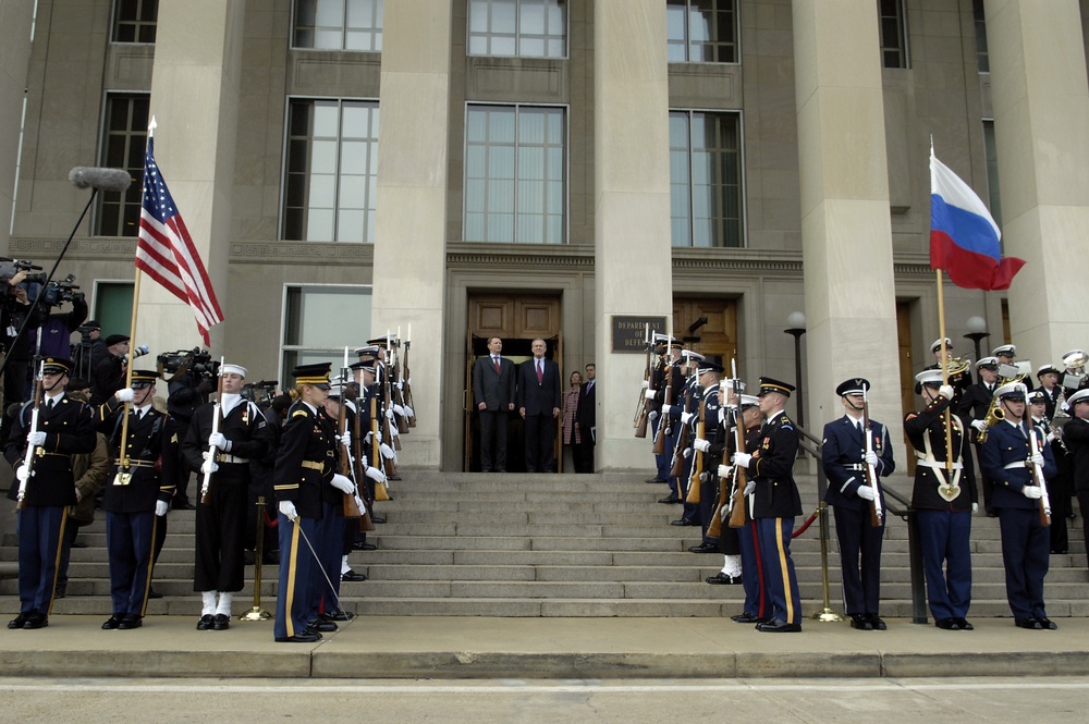 Russian Minister of Defense Sergey Ivanov and Secretary Rumsfeld listen as the Russian National Anthem is played.