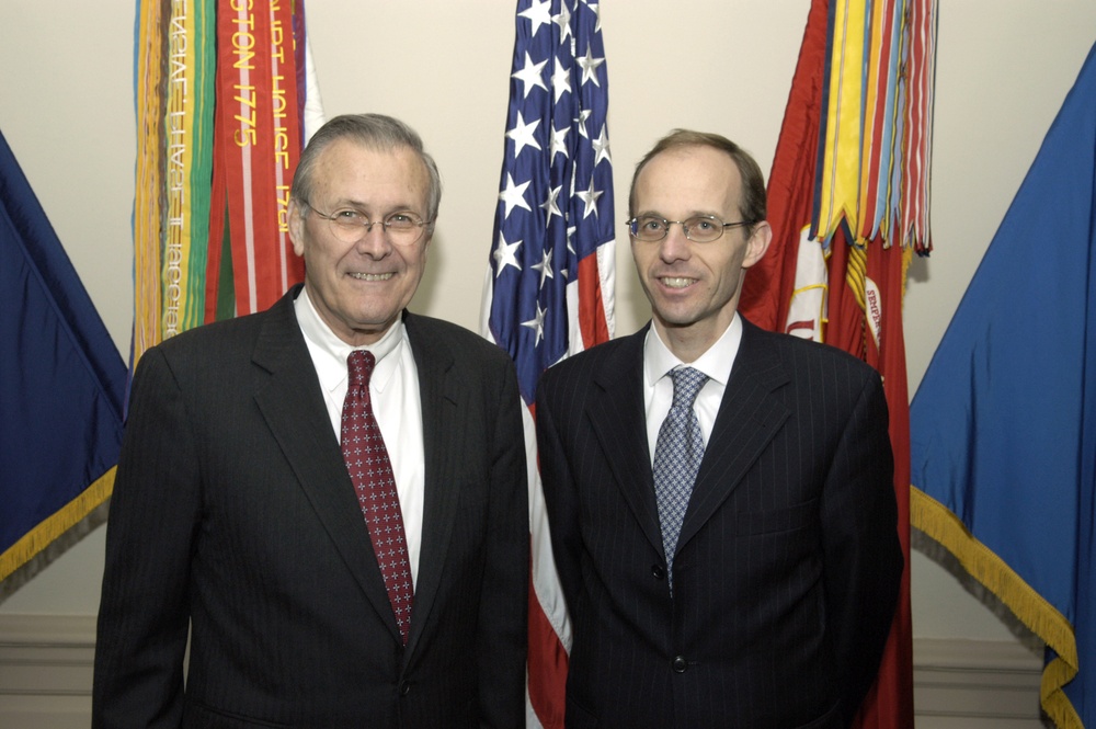 Secretary Rumsfeld and Luxembourg's Minister of Defense Luc Frieden pose for photographs.