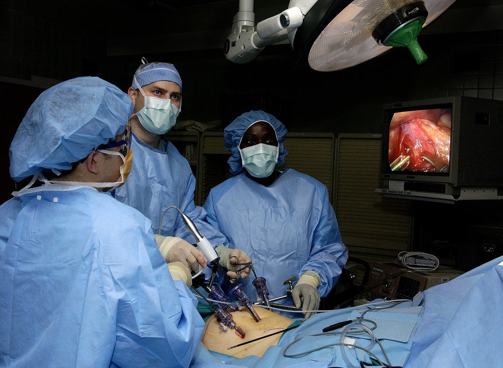 Doctors Ronald Post and John Smear and Physician's Assistant Debra Blackshire perform laparoscopic stomach surgery.