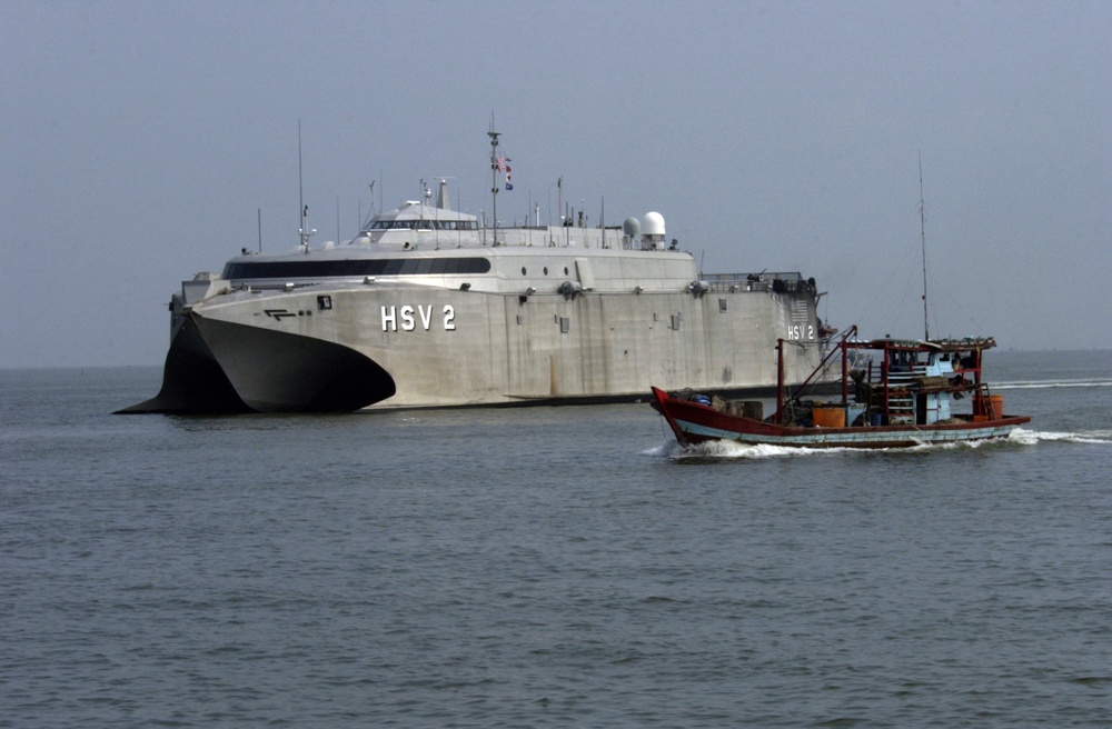 The USS Swift (HSV 2) prepares to dock at the pier in Belawan, Indonesia.