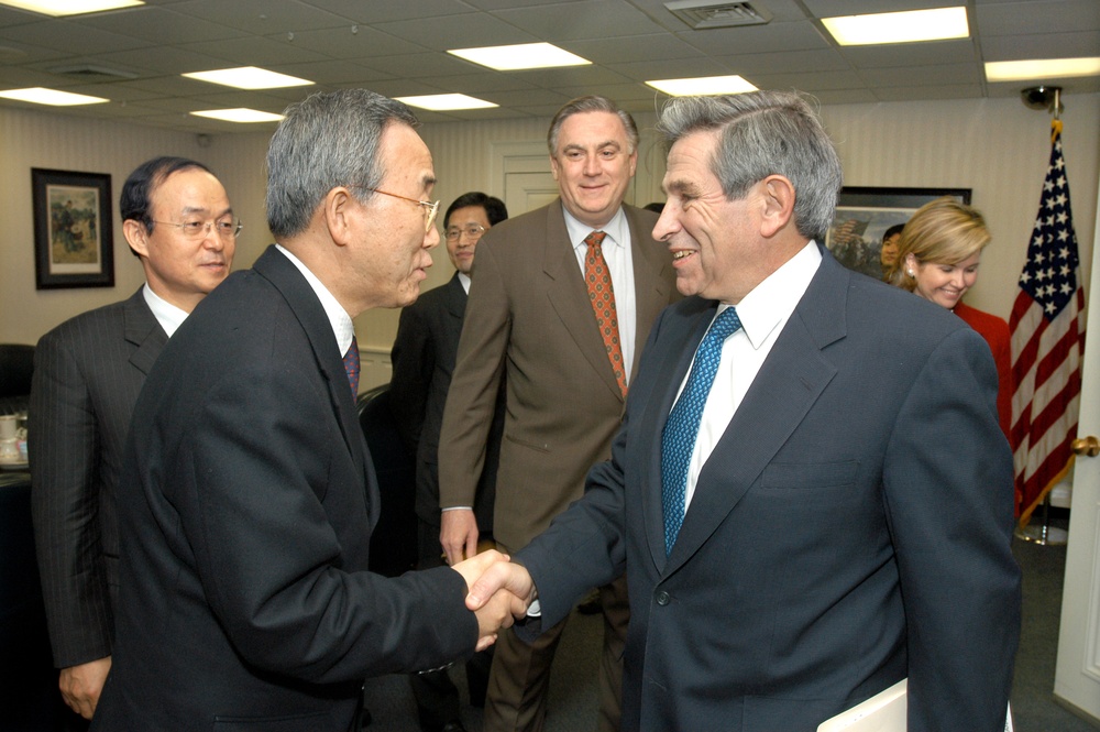 Deputy Secretary Wolfowitz greets South Korean Minister of Foreign Affairs and Trade Ban Ki-moon.