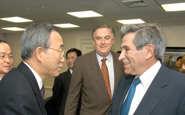 Deputy Secretary Wolfowitz greets South Korean Minister of Foreign Affairs and Trade Ban Ki-moon.