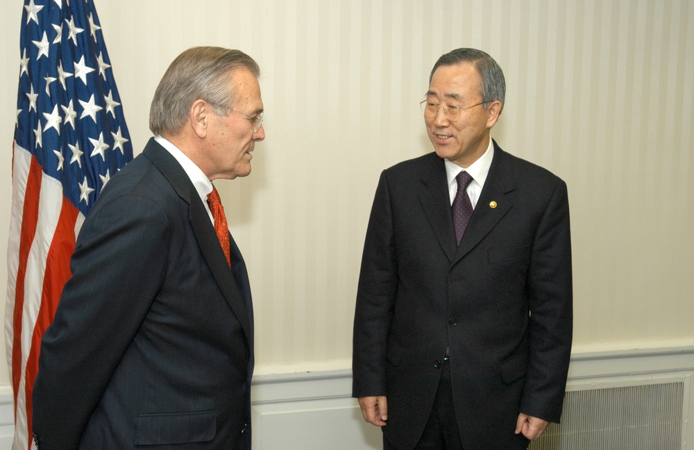 Secretary Rumsfeld talks informally with South Korean Minister of Foreign Affairs and Trade Ban Ki-moon.