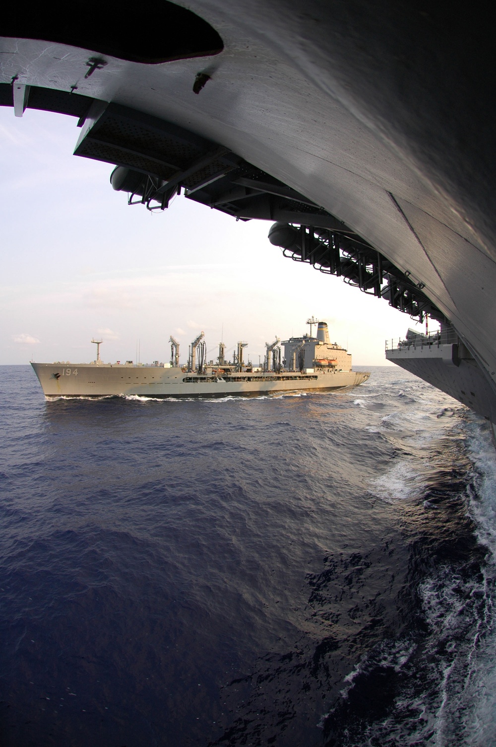 The USNS John Ericsson (T-AO 194) pulls away from the aircraft carrier USS Kitty Hawk (CV 63).