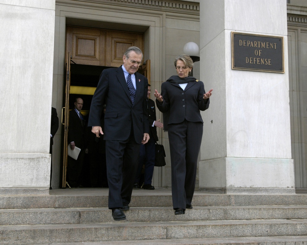 Secretary Rumsfeld escorts French Minister of Defense Michelle Alliot-Marie to her car.