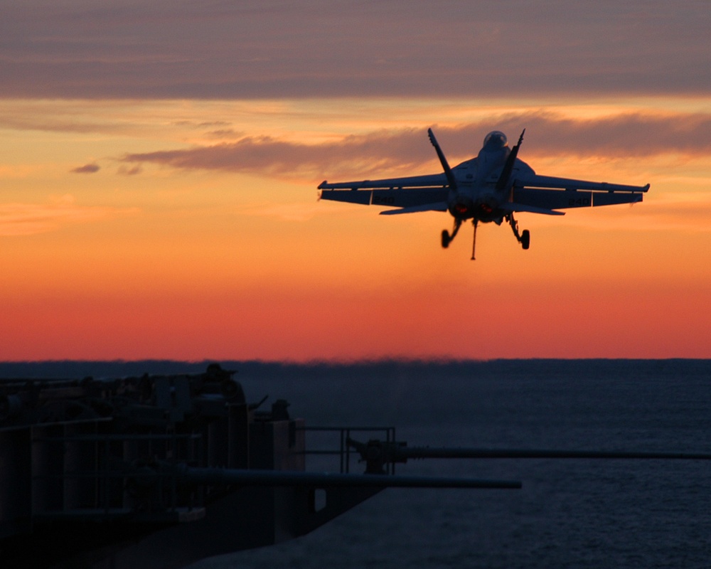 A Navy F/A-18F Super Hornet launches off the flight deck.