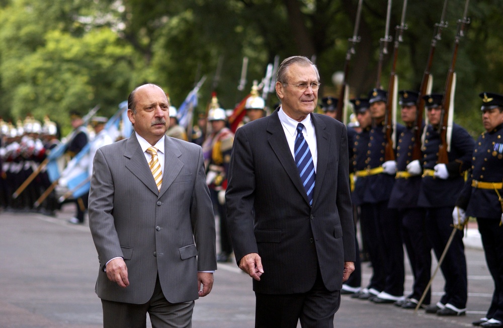 Argentina's Minister of Defense Jose Pampuro escorts Secretary Rumsfeld as he inspects the honor guard.