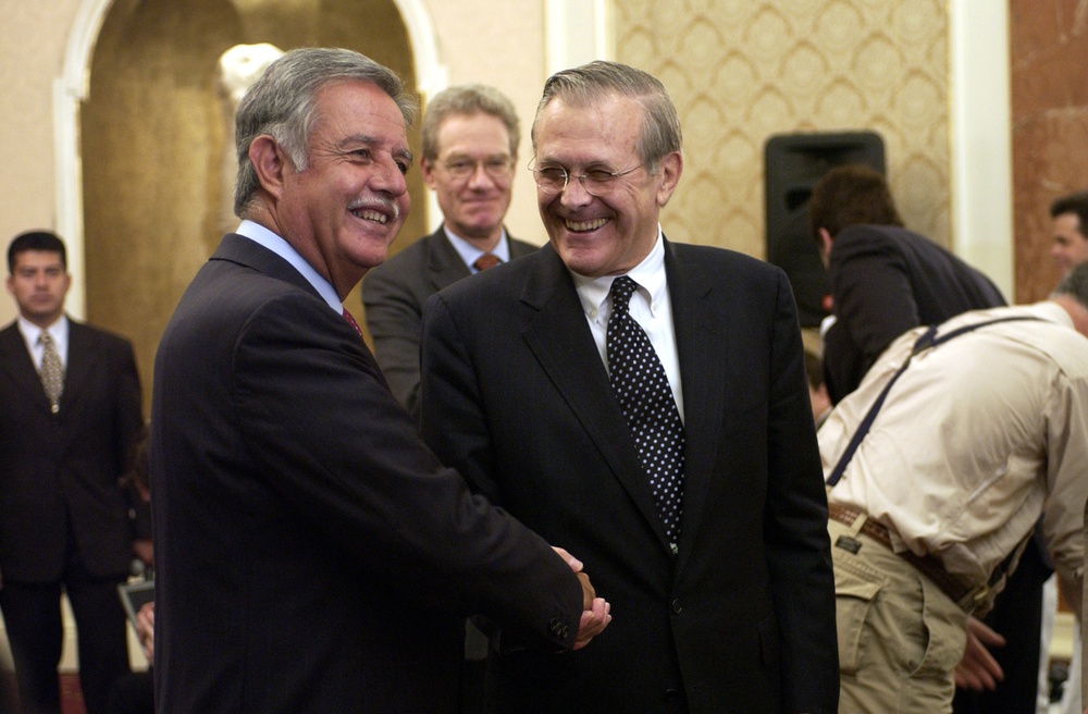 Secretary Rumsfeld and Guatemalan President Oscar Jose Rafael Berger Perdomo shake hands.