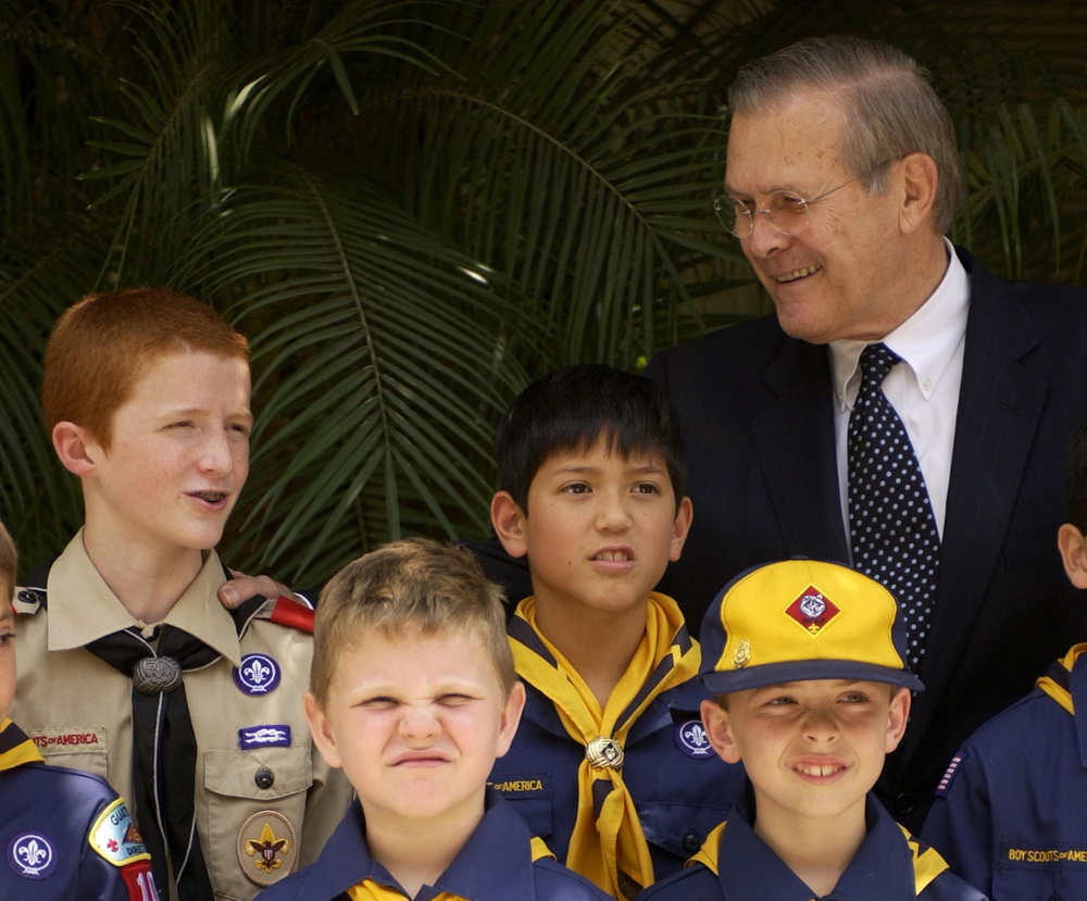 Secretary Rumsfeld poses for a group photo with Cub and Boy Scouts.