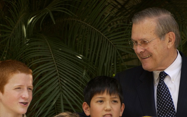 Secretary Rumsfeld poses for a group photo with Cub and Boy Scouts.