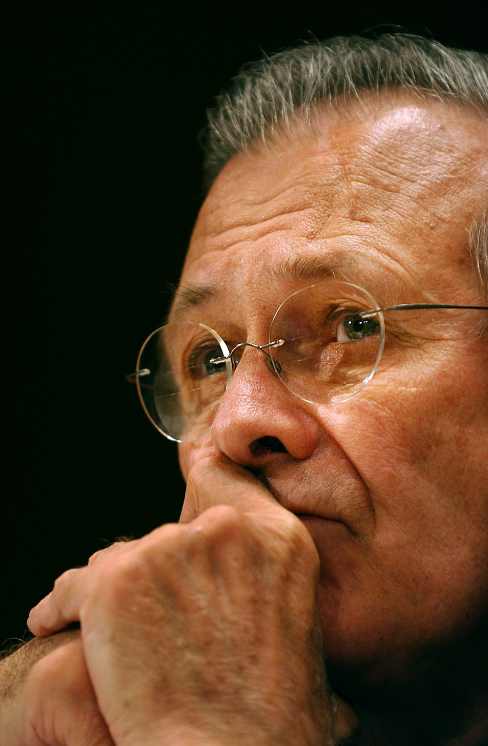 Secretary of Defense Donald H. Rumsfeld listens to a senator's question.