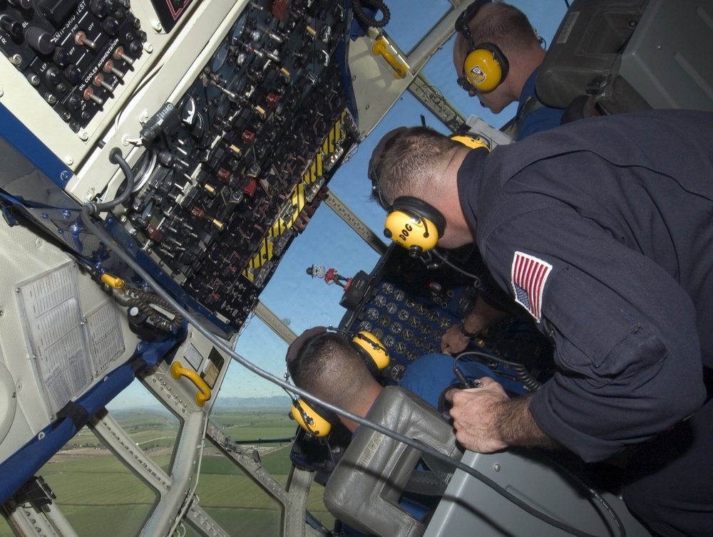 U.S. Marine Corps Maj. Ken Asbridge and Maj. Stefan Mueller bank the C-130 Hercules known as Fat Albert.