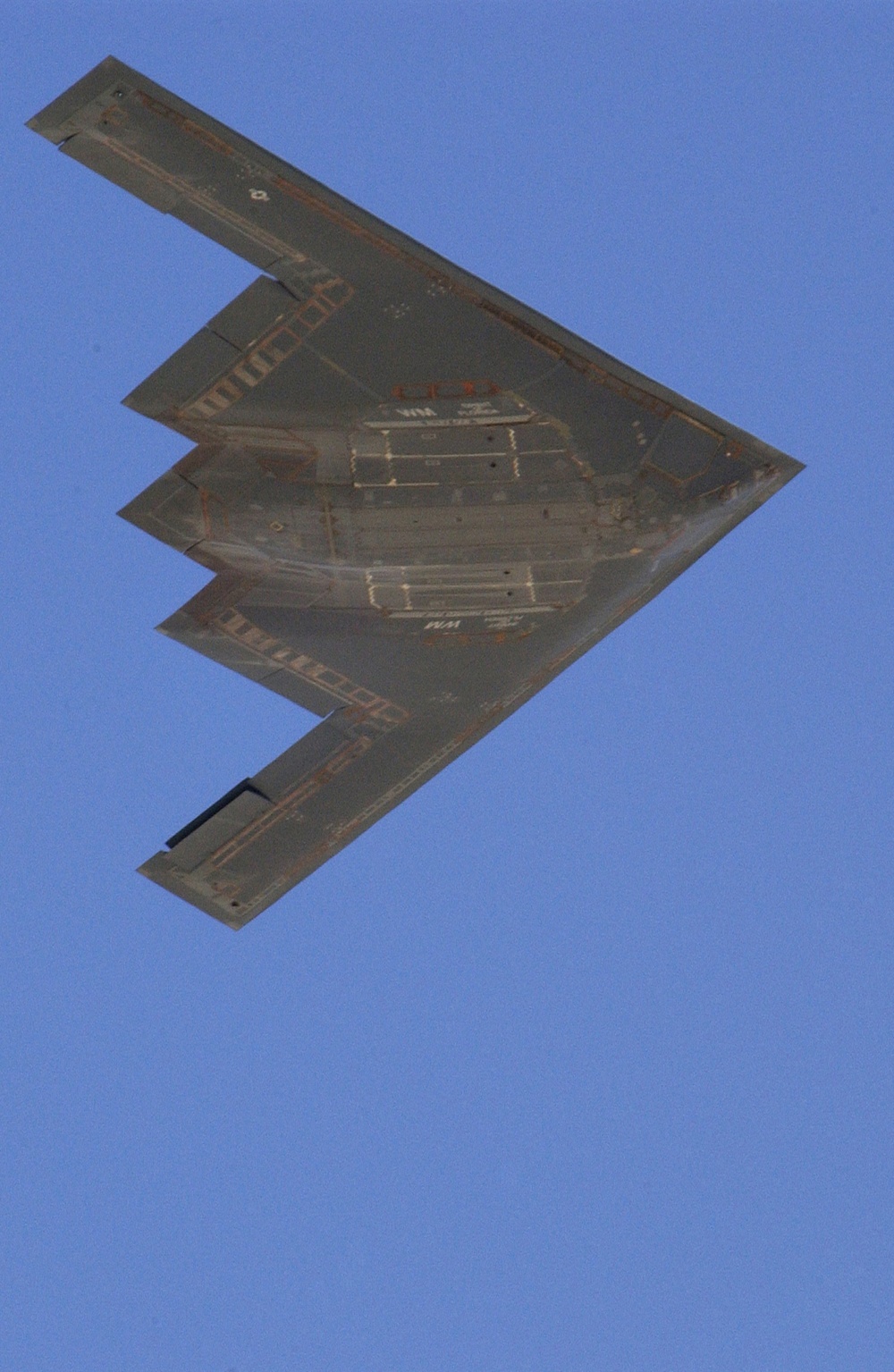 A U.S. Air Force B-2 Spirit bomber flies by after dropping MK-82 500-pound bombs.