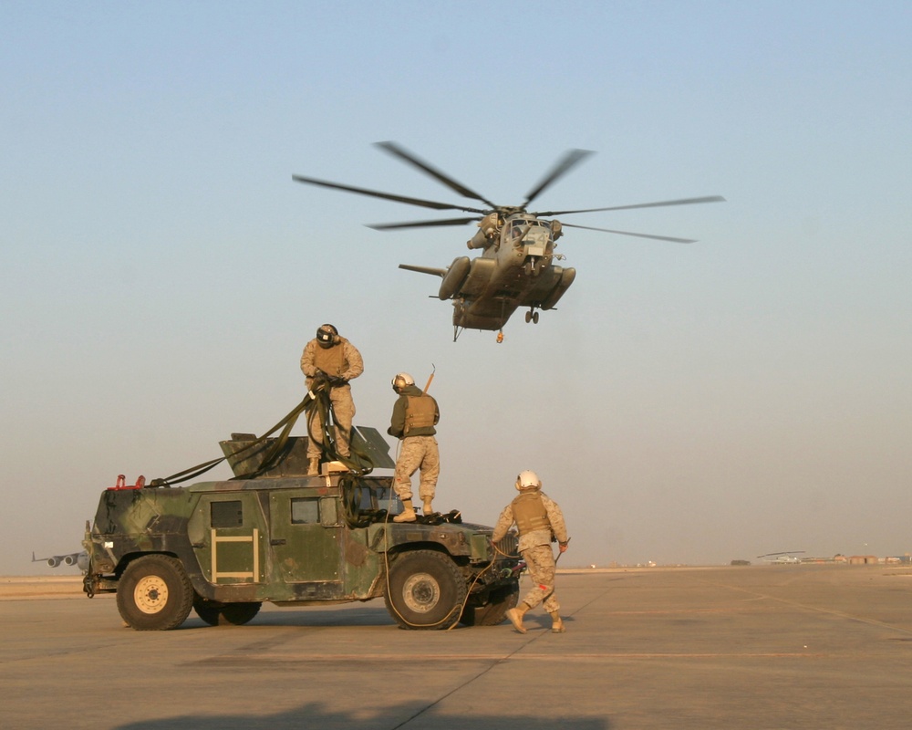 U.S. Marines make final preparations to a Humvee.