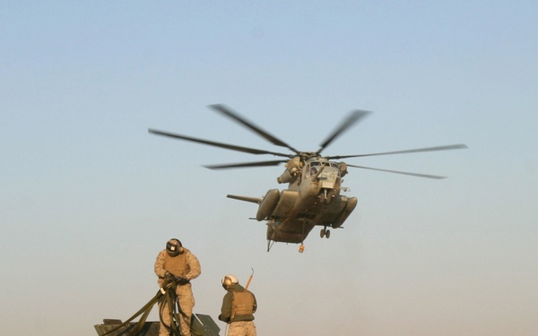 U.S. Marines make final preparations to a Humvee.