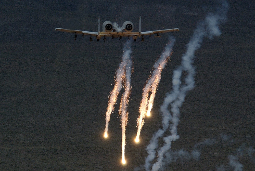 An Air Force A-10 Thunderbolt releases chaff and flares.
