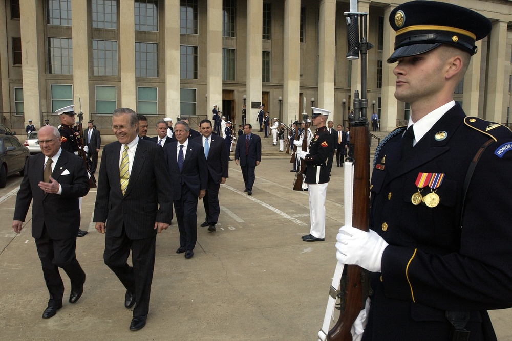 Secretary of Defense Donald H. Rumsfeld escorts President of Nicaragua Enrique Bolanos.