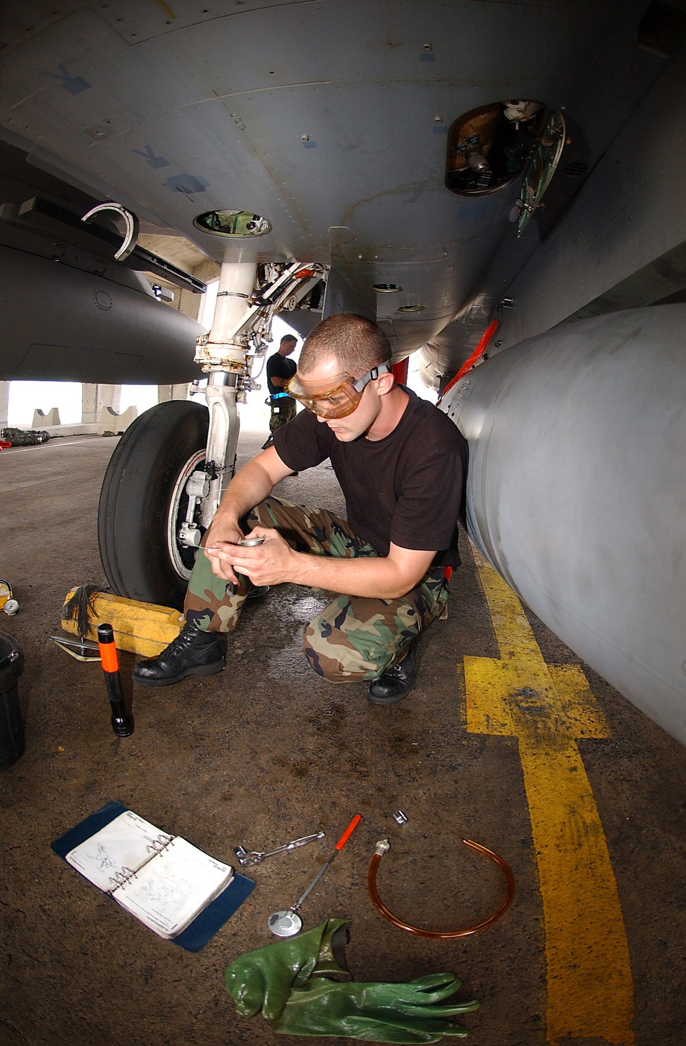 U.S. Air Force Staff Sgt. Justin Fears checks fluid levels.