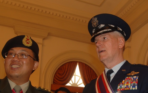 Gen. Richard B. Myers talks with Chairman of Defense for Singapore Lt. Gen. Ng Yat Chung.
